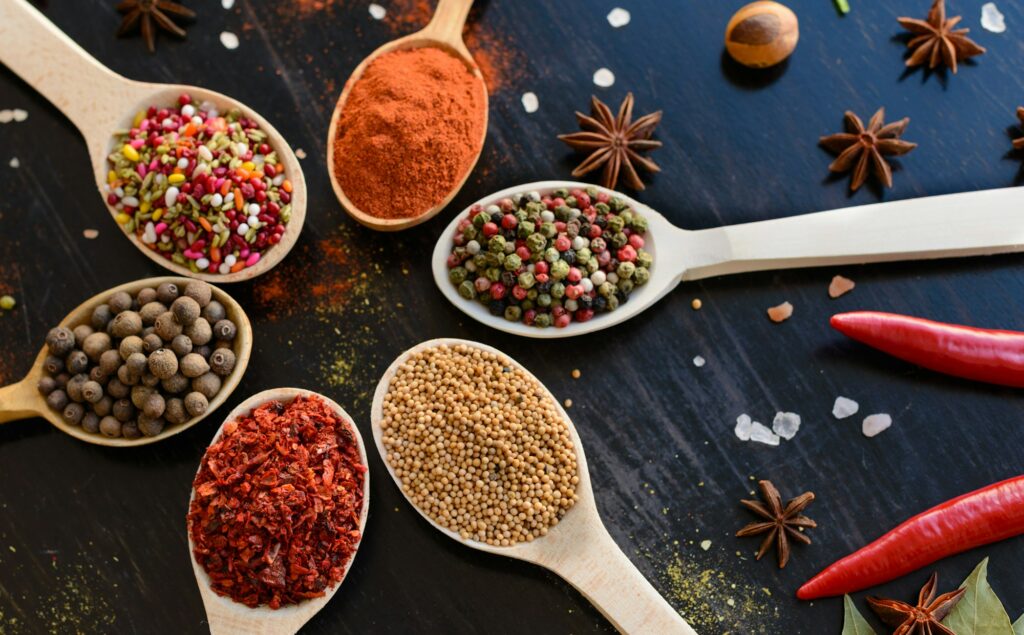 Spices and herbs on old kitchen table